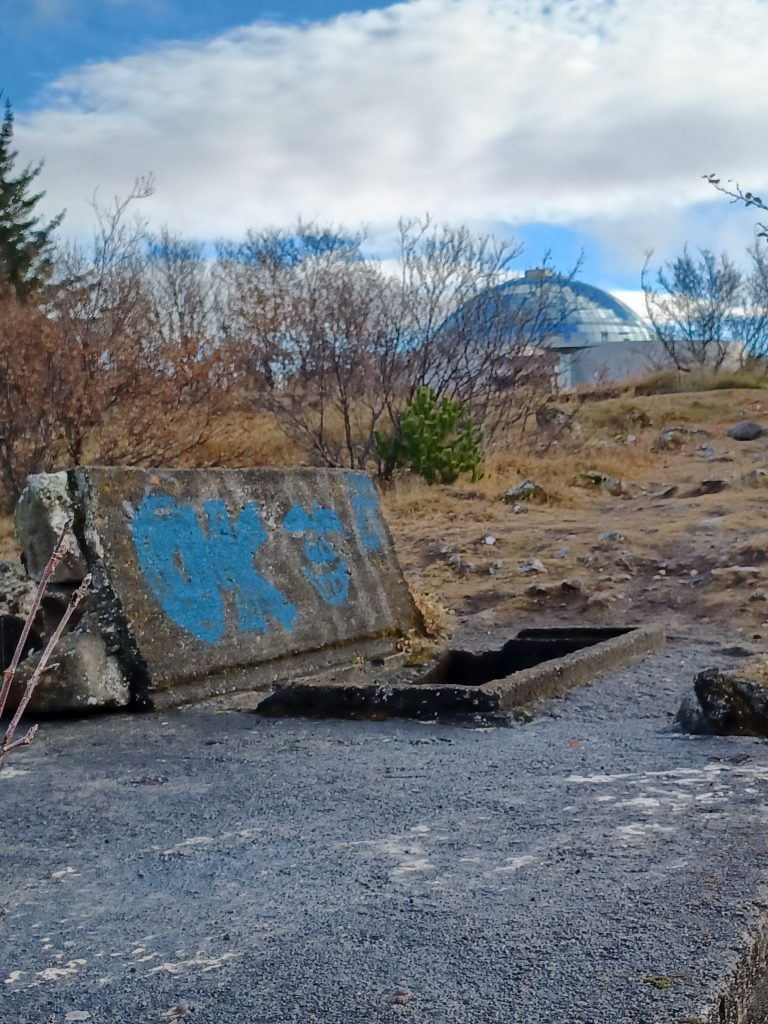 Entrance to pillbox on Öskjuhlíð hill with Perlan behind