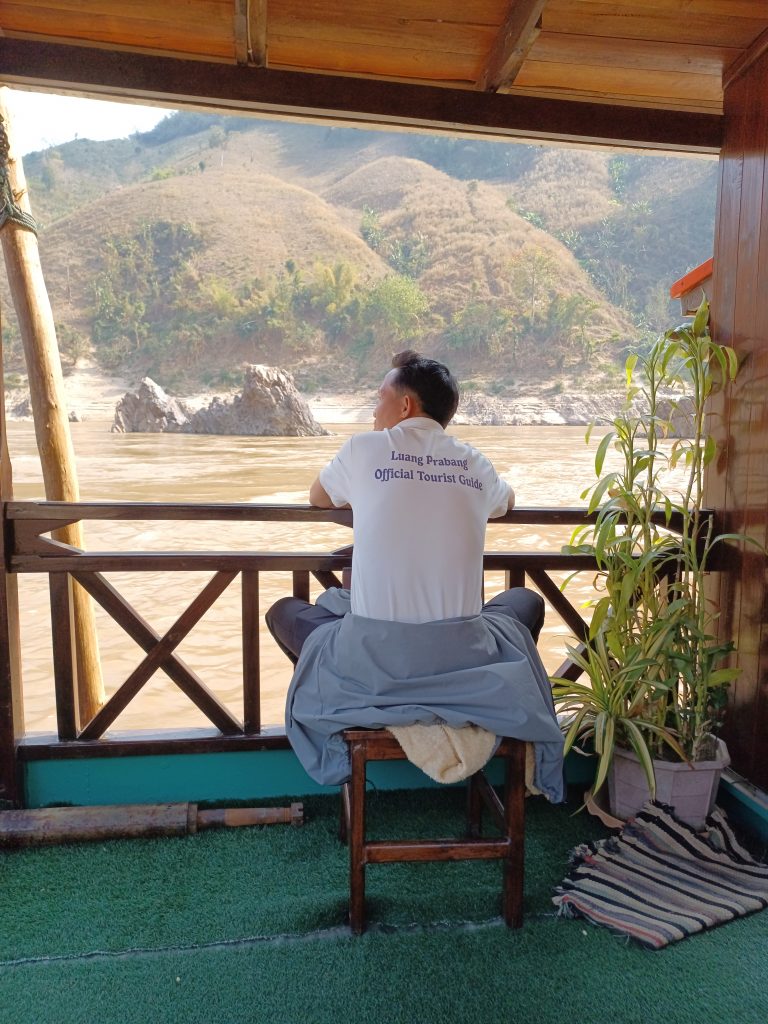 Local guide on the Mekong River boat