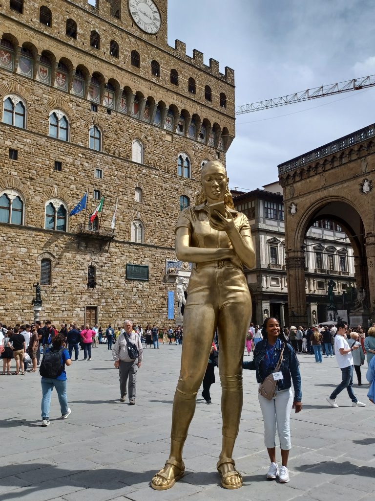 Time Unfolding by Thomas J Price, Palazzo Vecchio behind