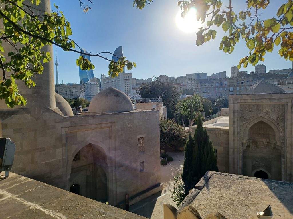 Parts of the Palace of the Shirvanshahs and Flame Towers beyond, Baku