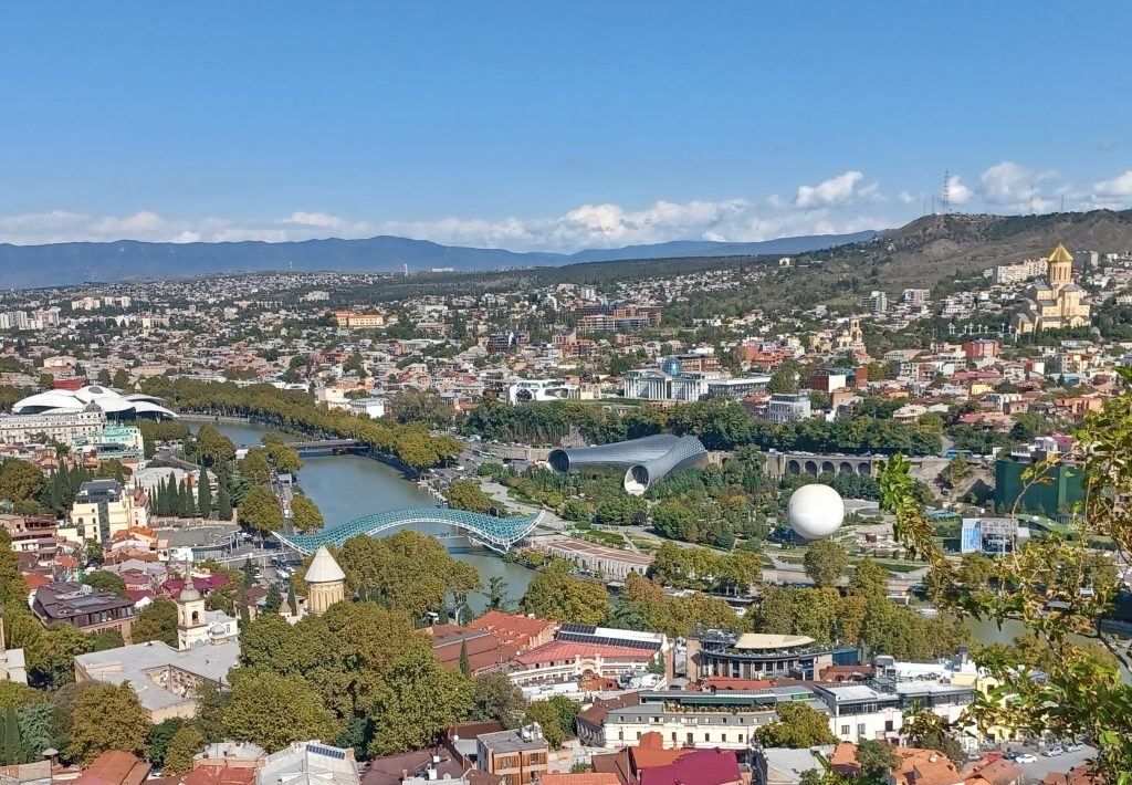 View from Narikala Fortress over river Mtkvari, Tbilisi: left: Bridge of Peace, right: Sameba Cathedral