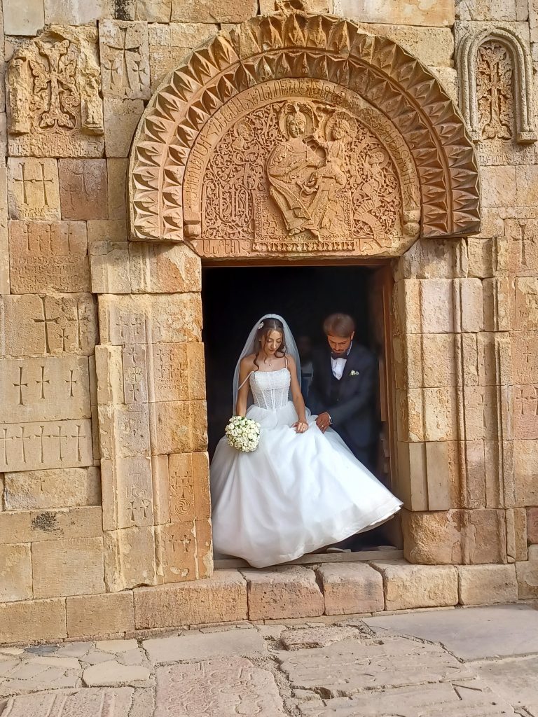 Happy couple exit Surb Stepanos church