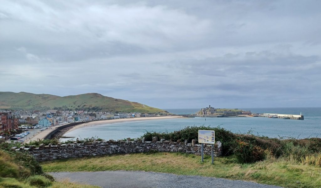 Peel Beach, Peel Hill, St Patrick's Isle with castle, and quay with lighthouse
