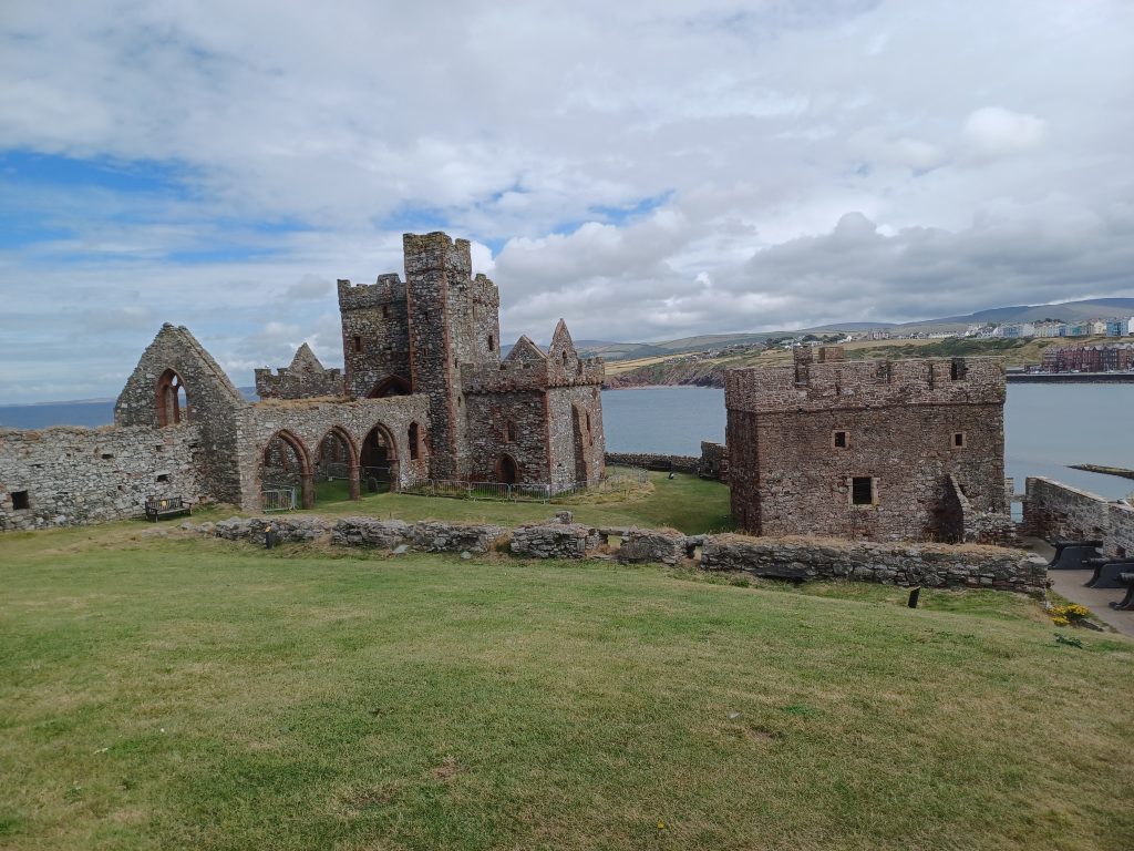 Ruins of St German's Cathedral (left), gatehouse and cannon (right). 