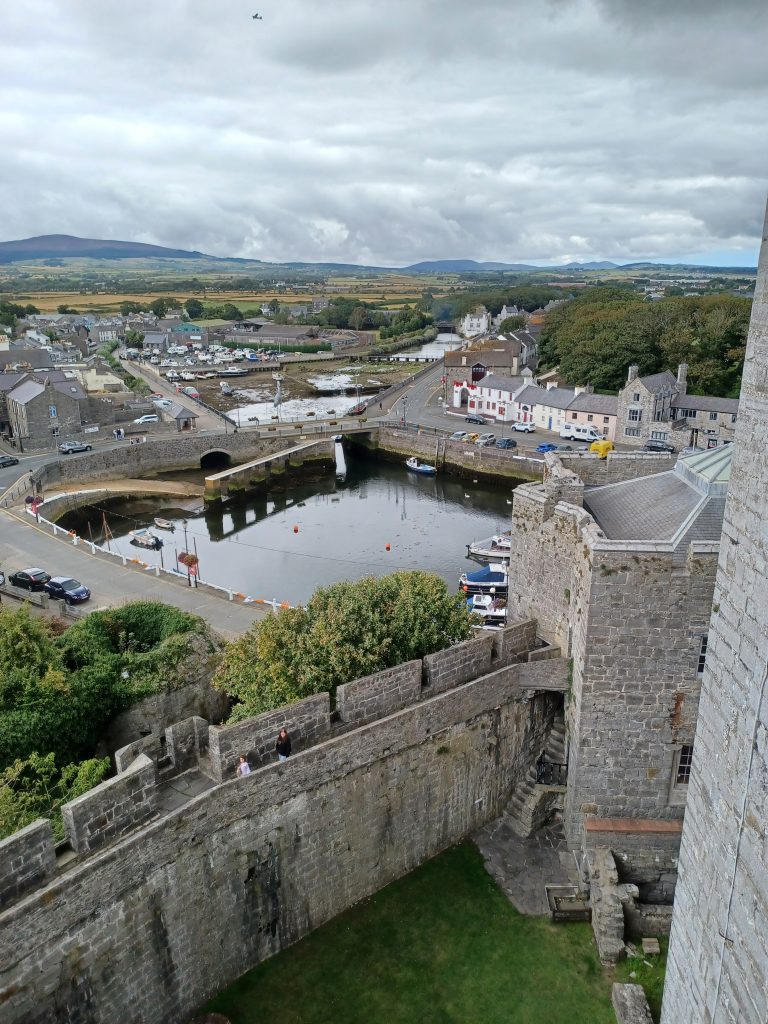 View from Castle Rushen of Boat Harbour, Castle Walls and Hills
